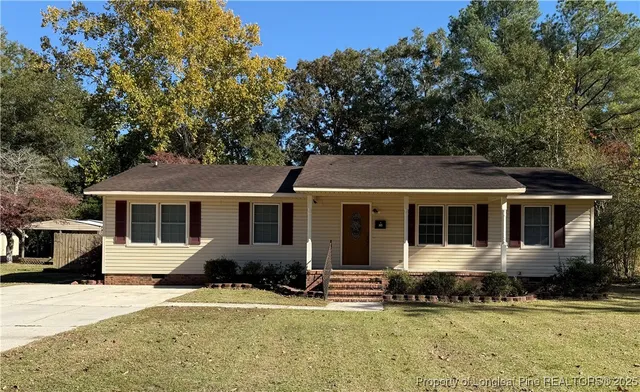 front view of a house with a yard