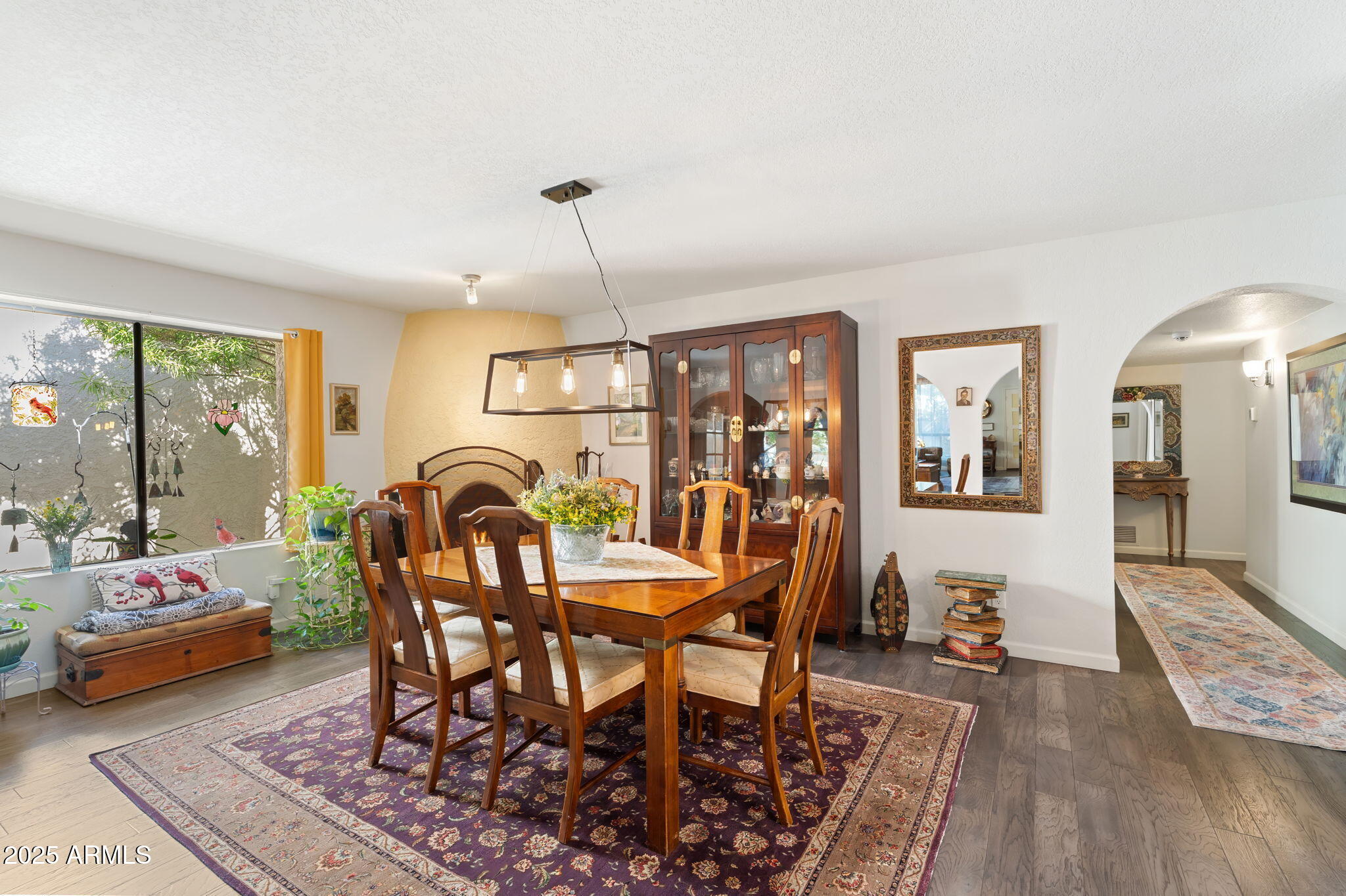 7217 North 6th Way Phoenix, AZ 85020 - Photo 19 of 43 a view of a dining room with furniture window and wooden floor