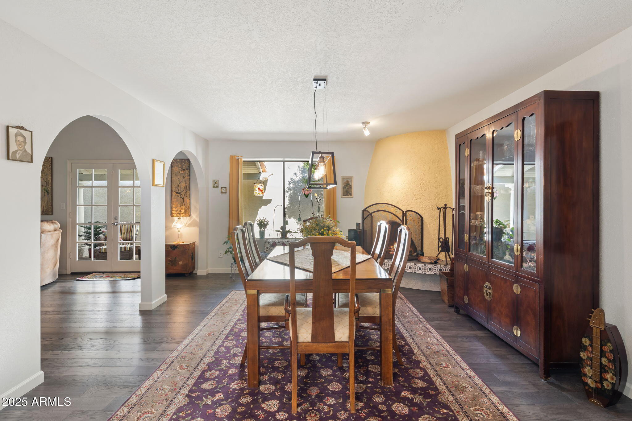 7217 North 6th Way Phoenix, AZ 85020 - Photo 20 of 43 a dining room with furniture a chandelier and wooden floor