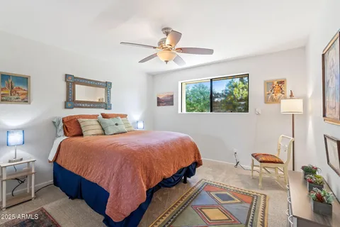 a bedroom with bed and a window