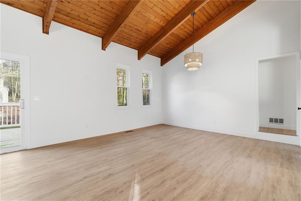 3447 Dry Creek Road Marietta, GA 30062 - Photo 9 of 50 an empty room with wooden floor and windows