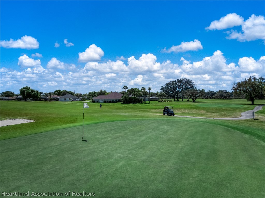 4734 Haw Branch Road, Unit 110 Sebring, FL 33875 - Photo 39 of 50 a view of a golf course with a lake