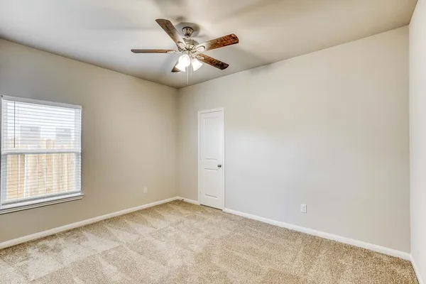 a bathroom with a sink toilet vanity and shower