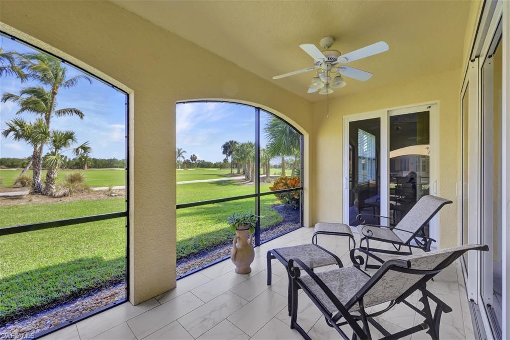 1276 Rialto Way, Unit 101 Naples, FL 34114 - Photo 20 of 37 a view of an chairs and table in a patio