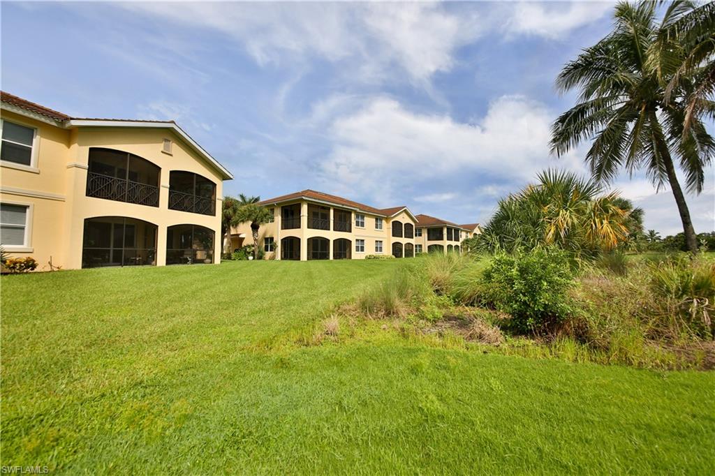 1276 Rialto Way, Unit 101 Naples, FL 34114 - Photo 24 of 37 a house view with a garden space
