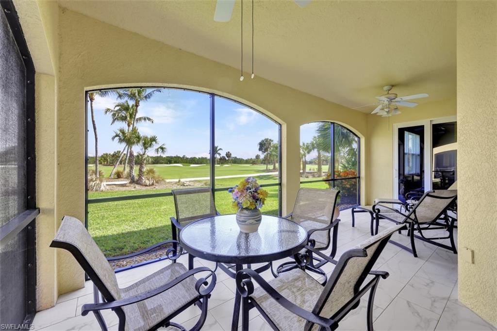1276 Rialto Way, Unit 101 Naples, FL 34114 - Photo 3 of 37 a view of a dining room with furniture window and outside view