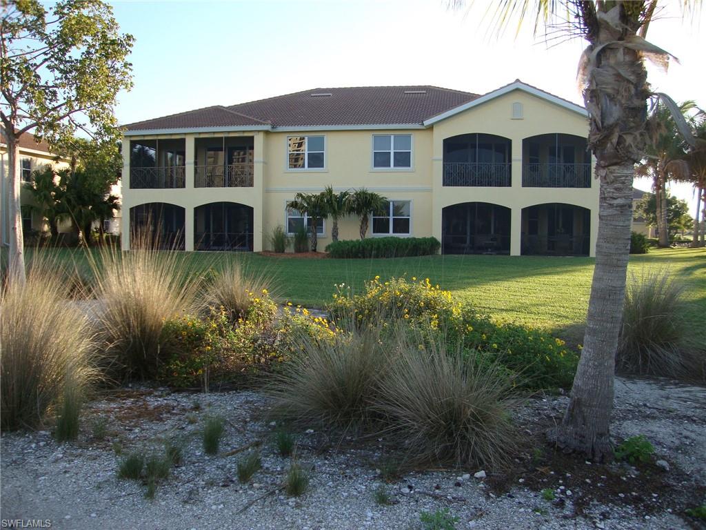 1276 Rialto Way, Unit 101 Naples, FL 34114 - Photo 7 of 37 a view of a yard in front of house