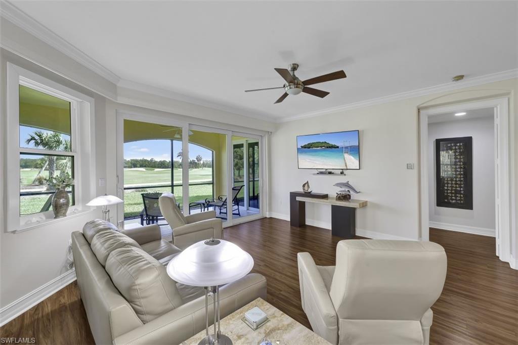 1276 Rialto Way, Unit 101 Naples, FL 34114 - Photo 8 of 37 a living room with furniture and a large window