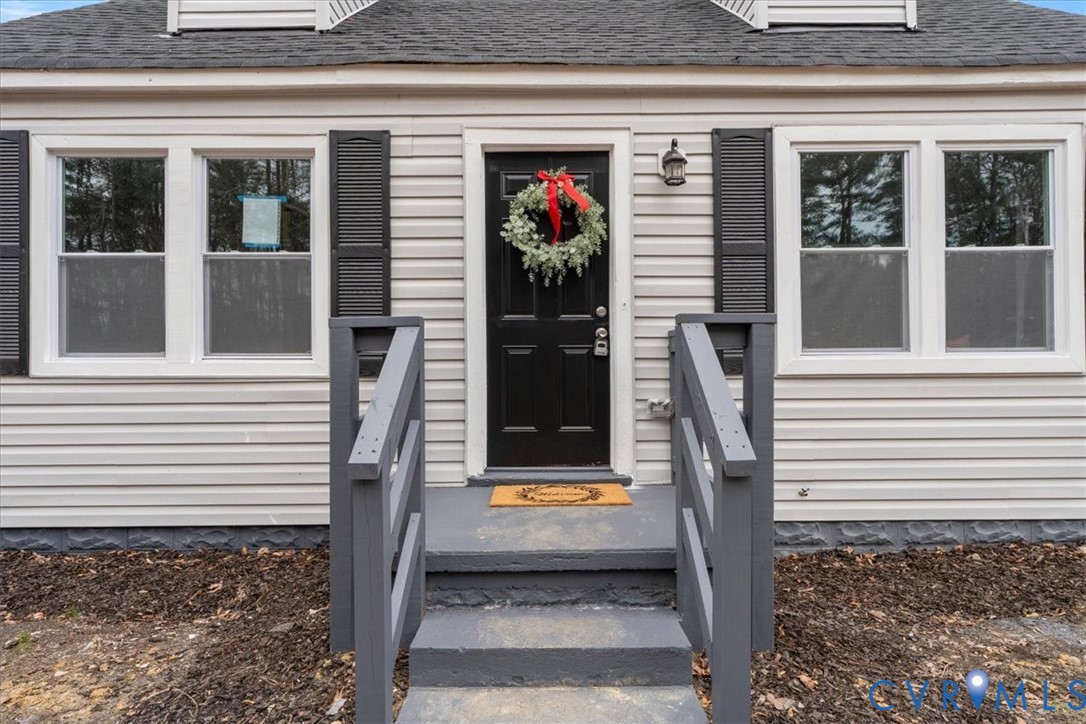 1989 Cox Road Blackstone, VA 23824 - Photo 8 of 44 View of exterior entry with a shingled roof
