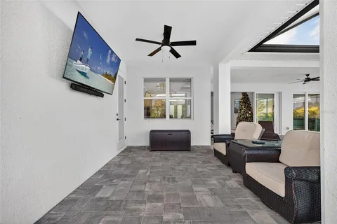 a view of swimming pool with outdoor seating and plants