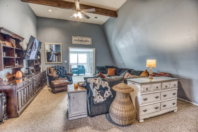 a bedroom with furniture and a chandelier