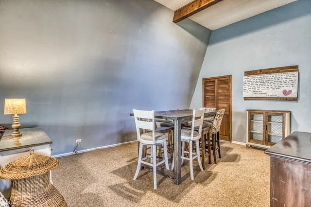 a patio with a dinning table and chairs
