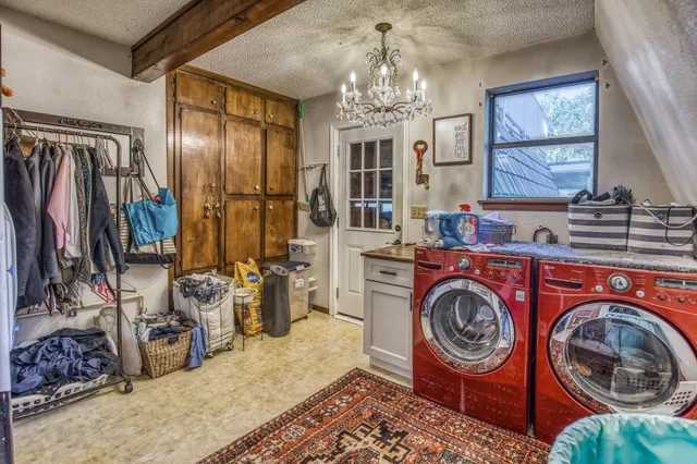 a utility room with closet dryer and washer