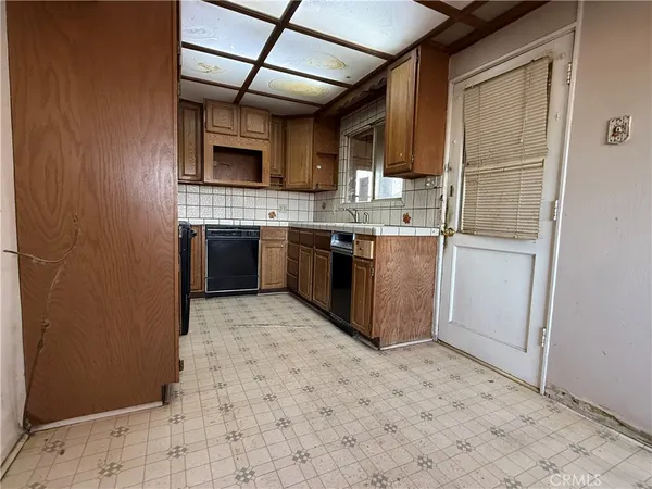 a kitchen with stainless steel appliances granite countertop a stove and a sink
