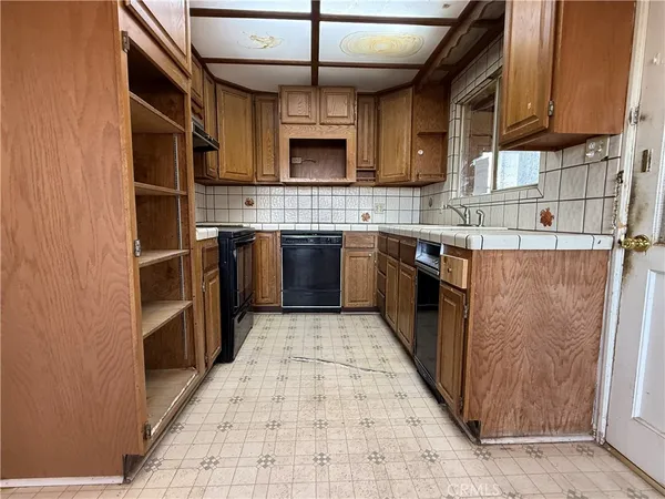 a view of a hallway with a couch