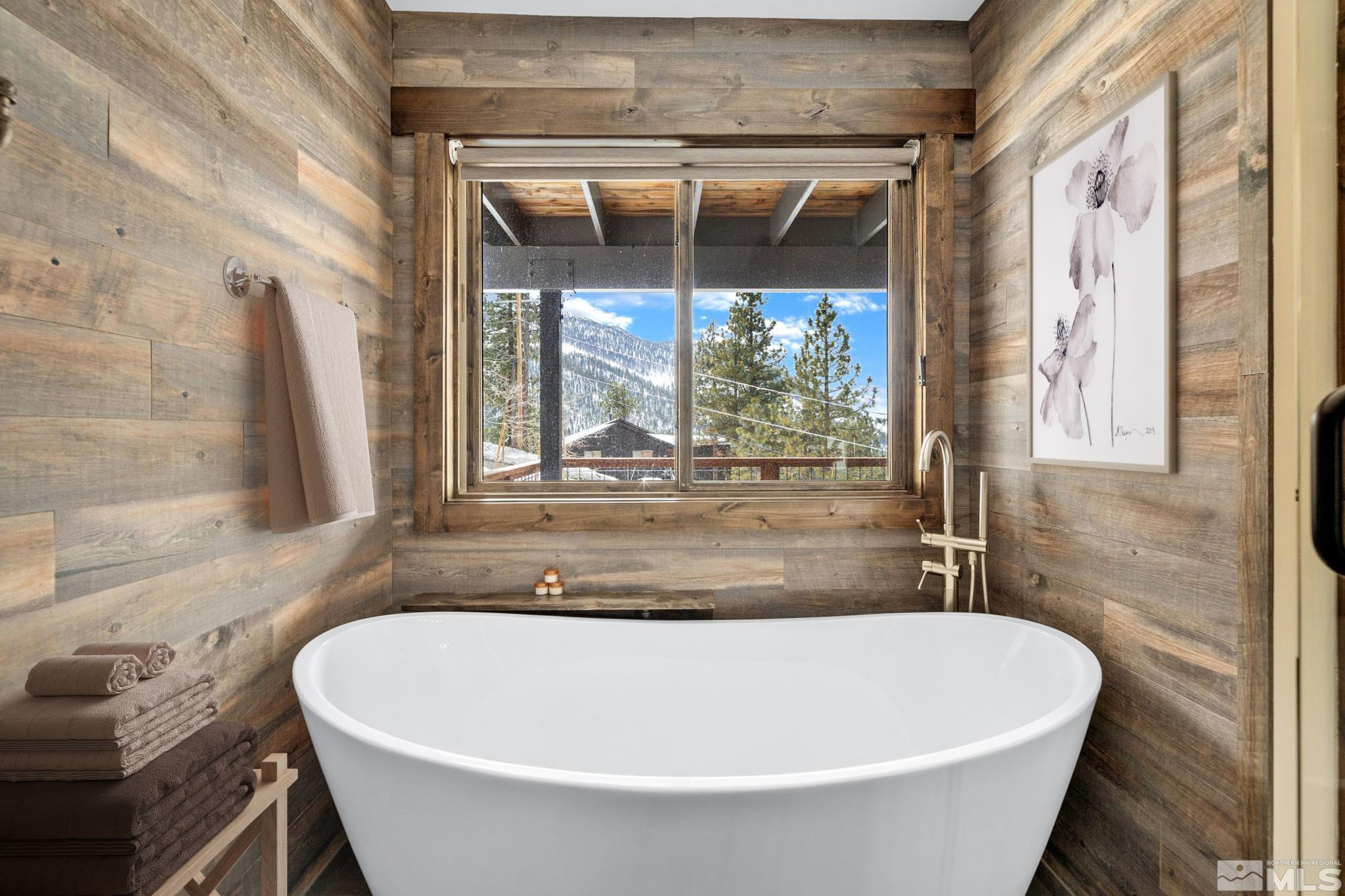 520 Laurel Lane Stateline, NV 89449 - Photo 15 of 29 a bath tub sitting in a bathroom next to a window