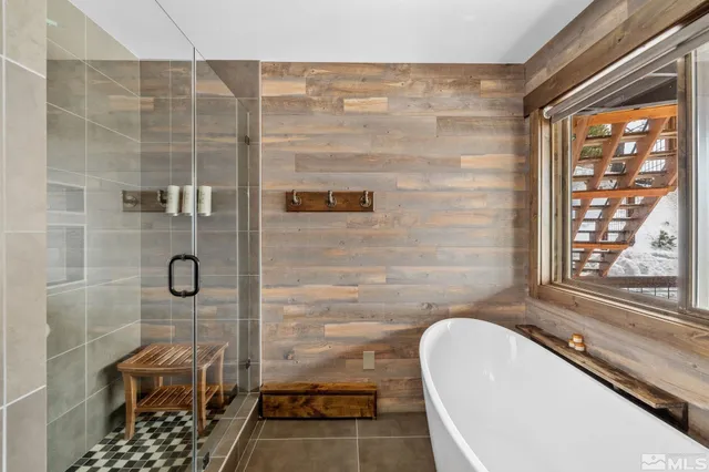 a bathroom with a granite countertop shower and a sink