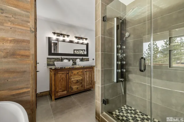 a bathroom with a shower and a sink