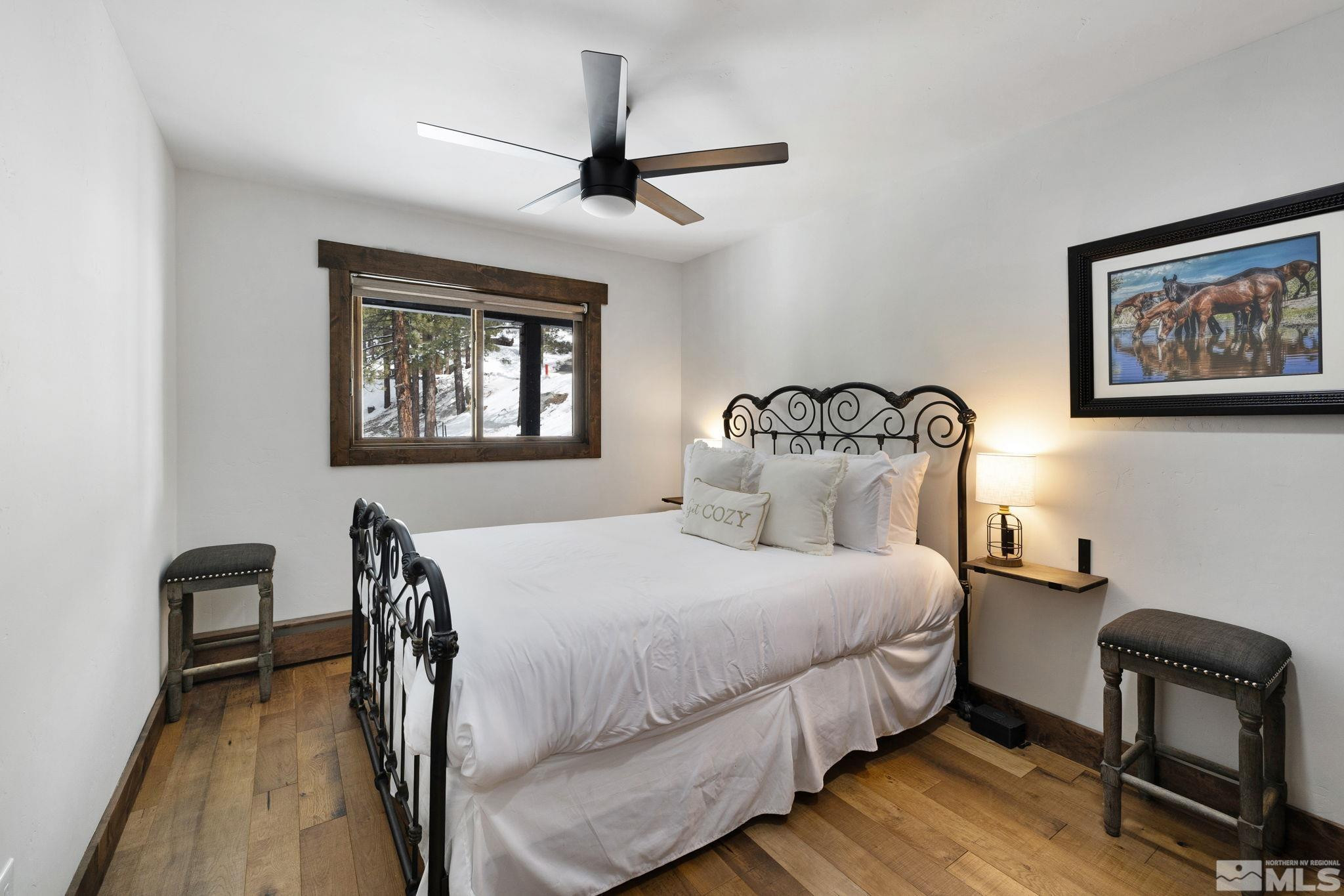 520 Laurel Lane Stateline, NV 89449 - Photo 19 of 29 a bedroom with a bed a desk and chair