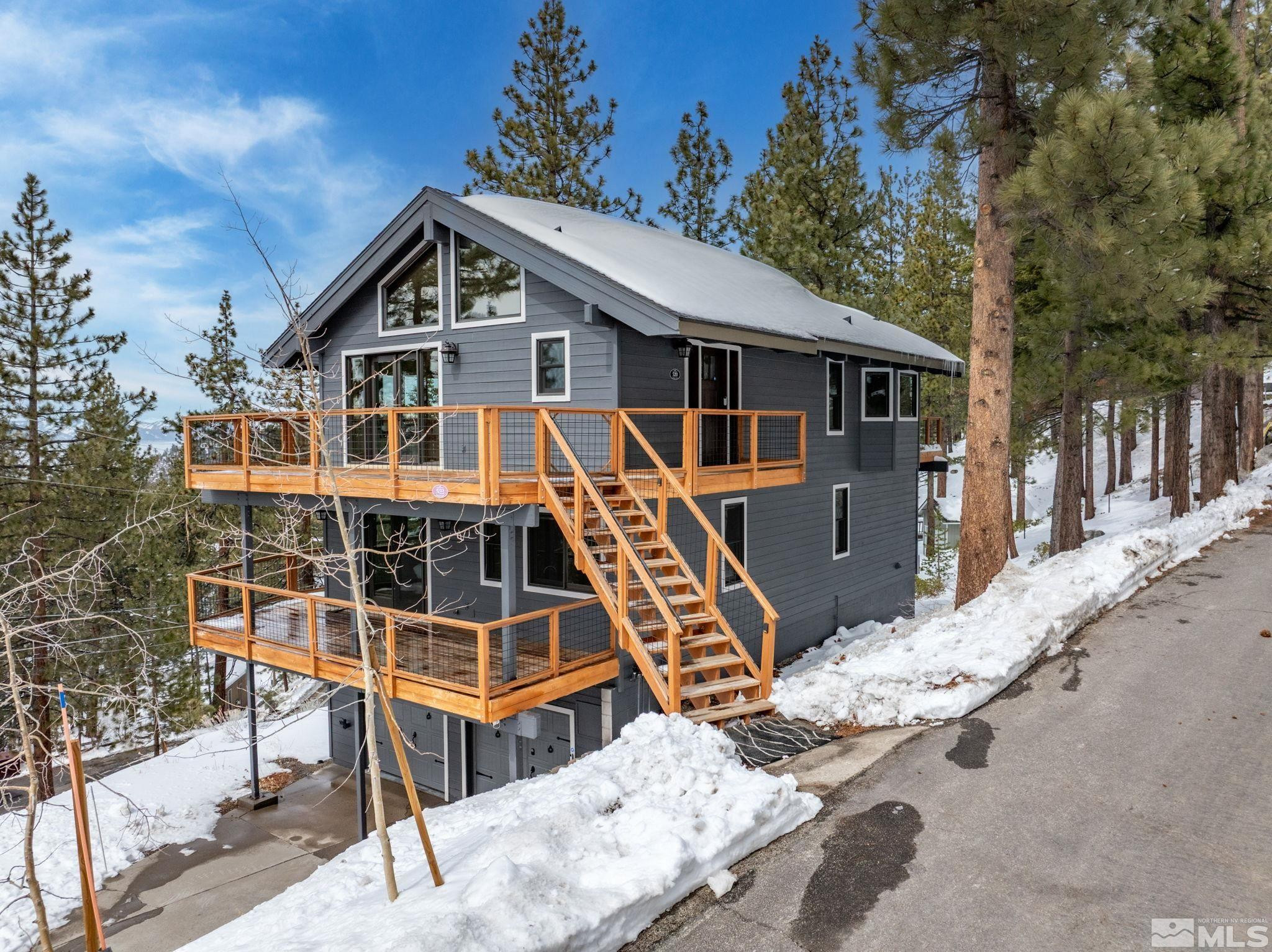 520 Laurel Lane Stateline, NV 89449 - Photo 2 of 29 a view of a house with wooden deck front of house