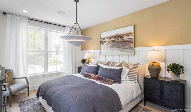 a bedroom with bed and window