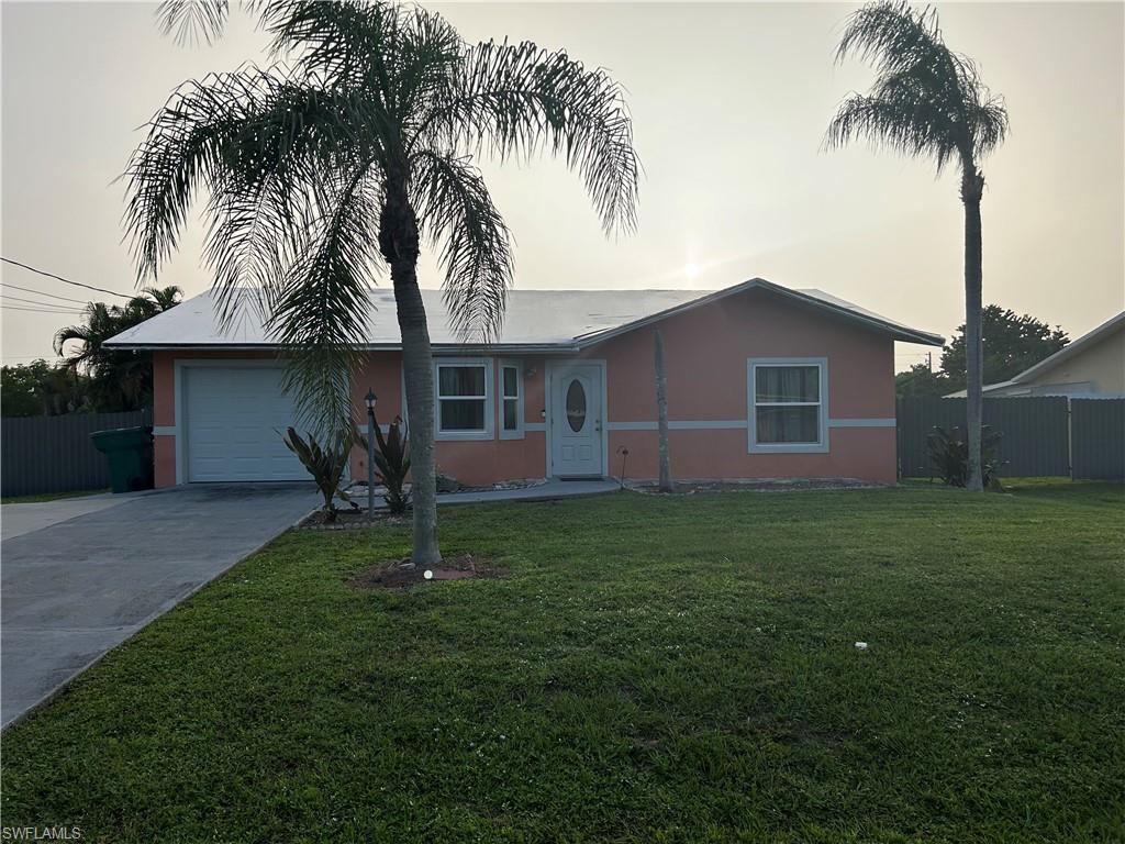 2049 50th Street Southwest Naples, FL 34116 - Photo 2 of 7 a house with a garden
