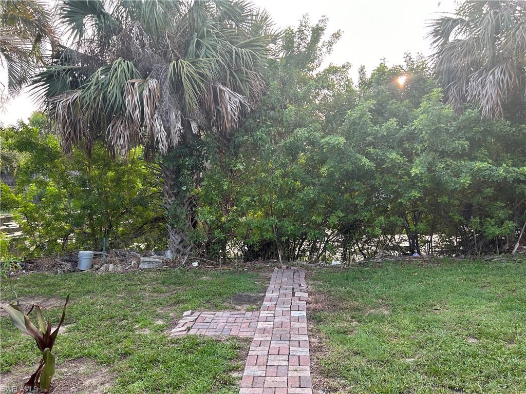 2049 50th Street Southwest Naples, FL 34116 - Photo 4 of 7 a view of yard with green space