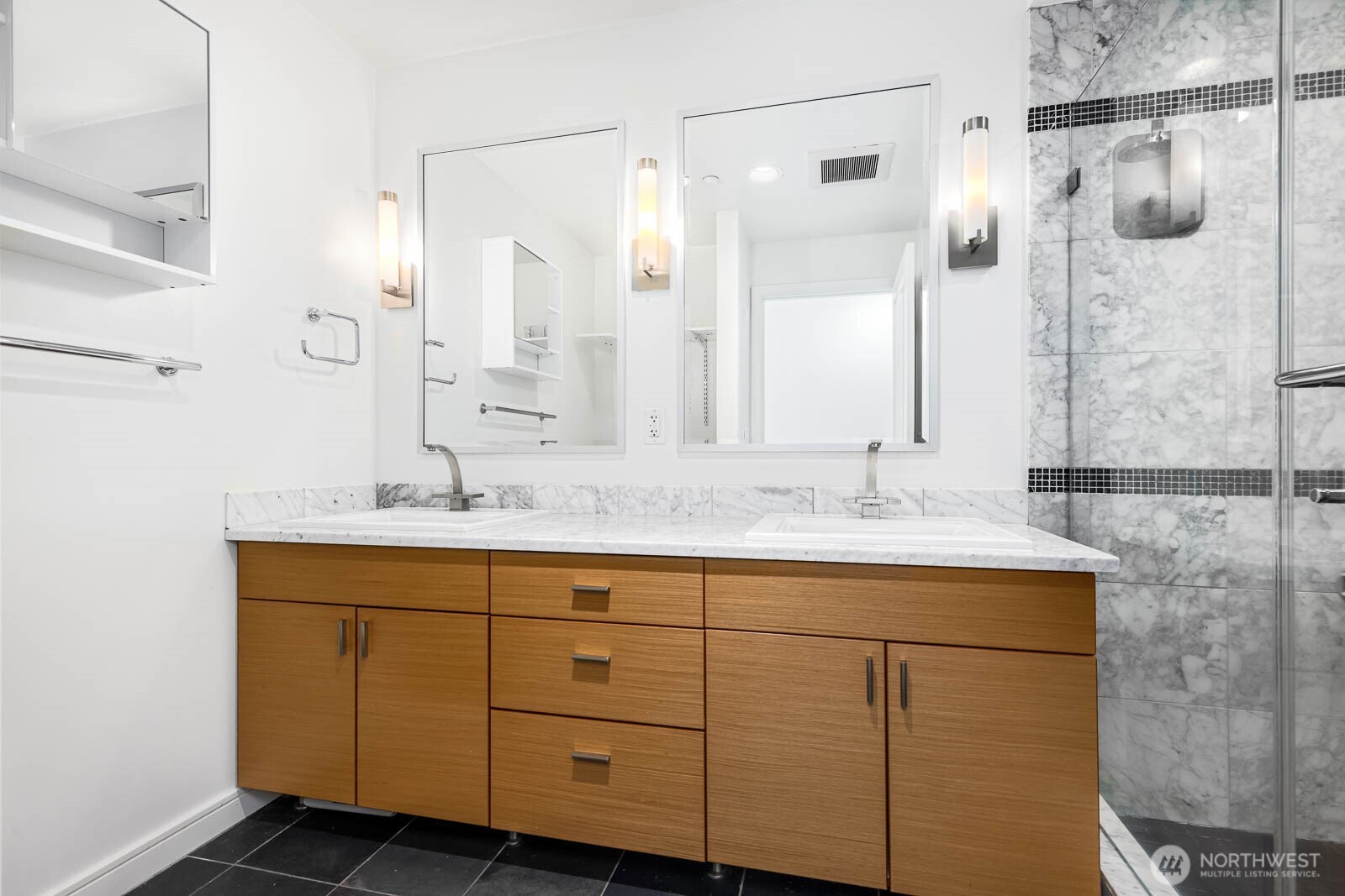 819 Virginia Street, Unit 3303 Seattle, WA 98101 - Photo 11 of 29 a bathroom with a sink and a mirror