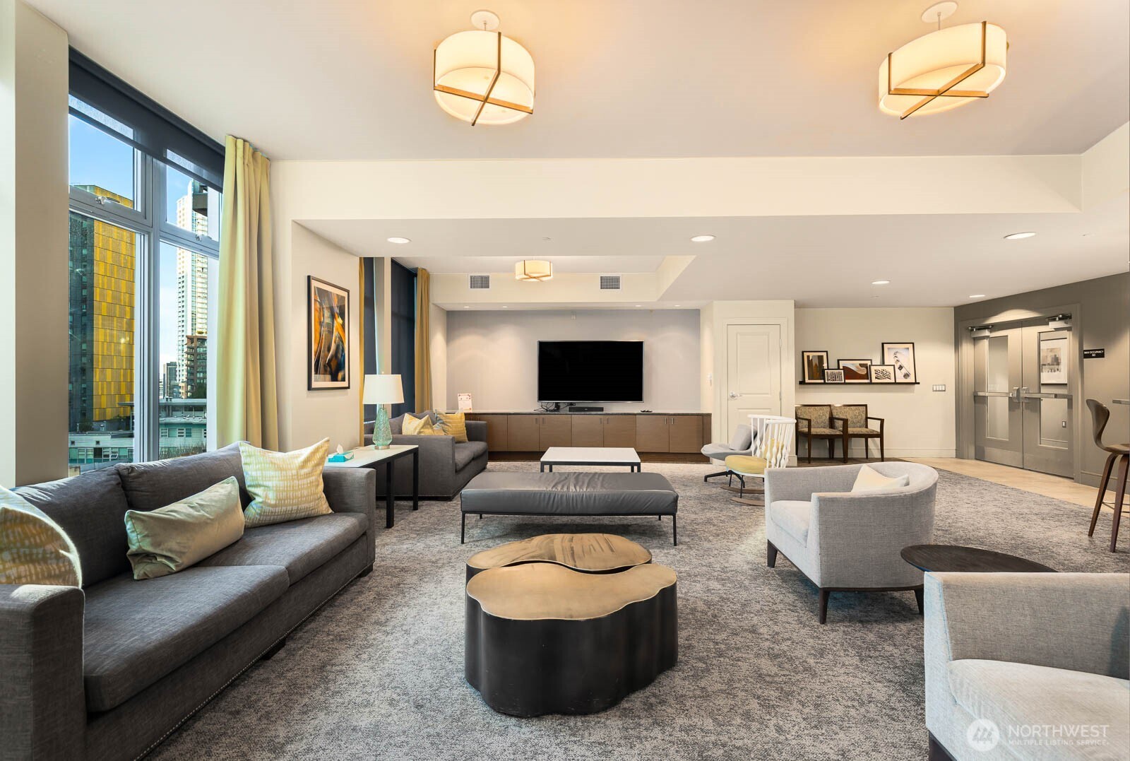 819 Virginia Street, Unit 3303 Seattle, WA 98101 - Photo 20 of 29 a living room with furniture and a flat screen tv