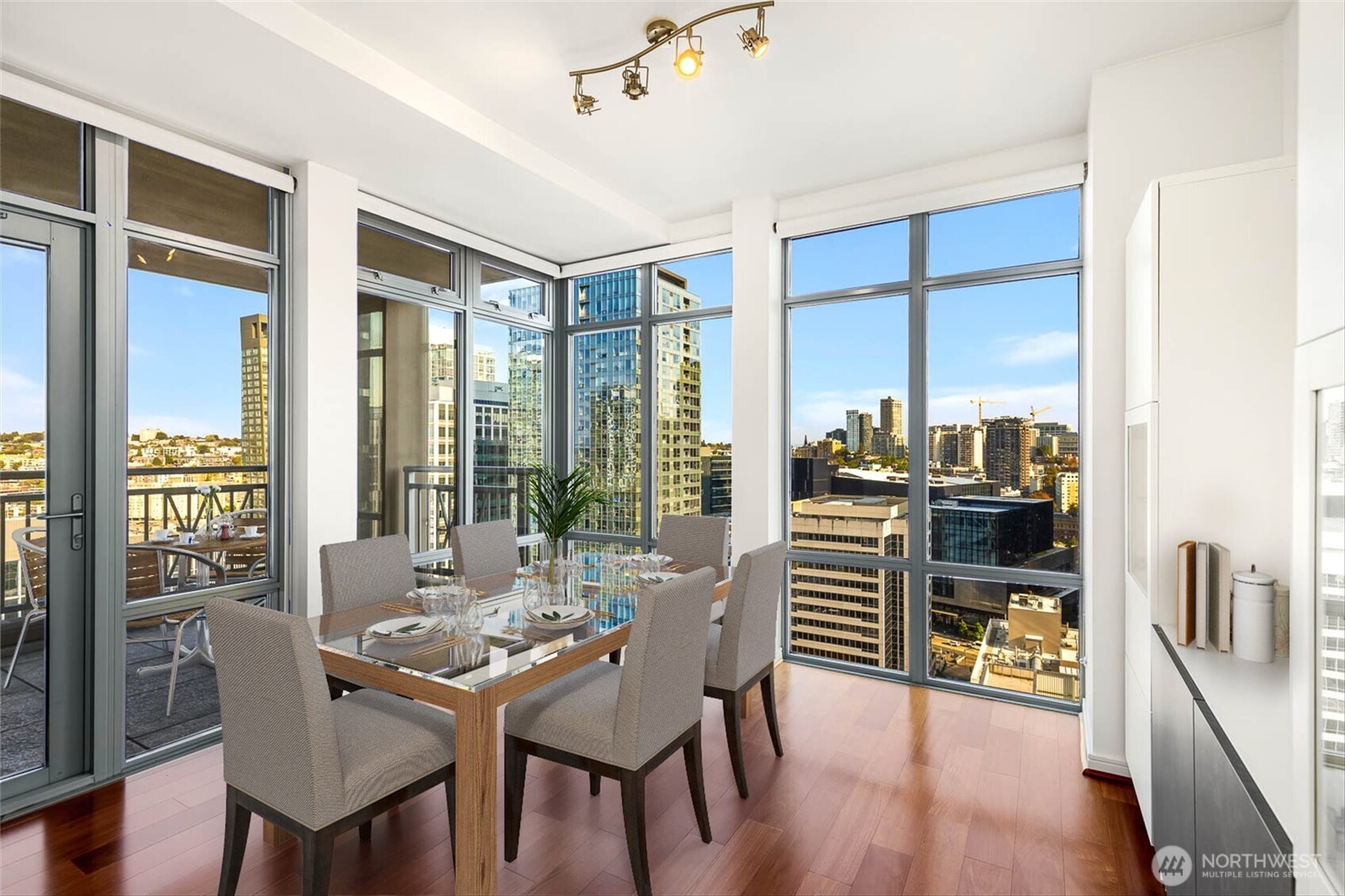 819 Virginia Street, Unit 3303 Seattle, WA 98101 - Photo 7 of 29 a dining room with furniture and wooden floor