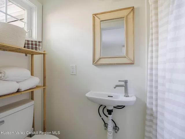 a bathroom with a sink and mirror