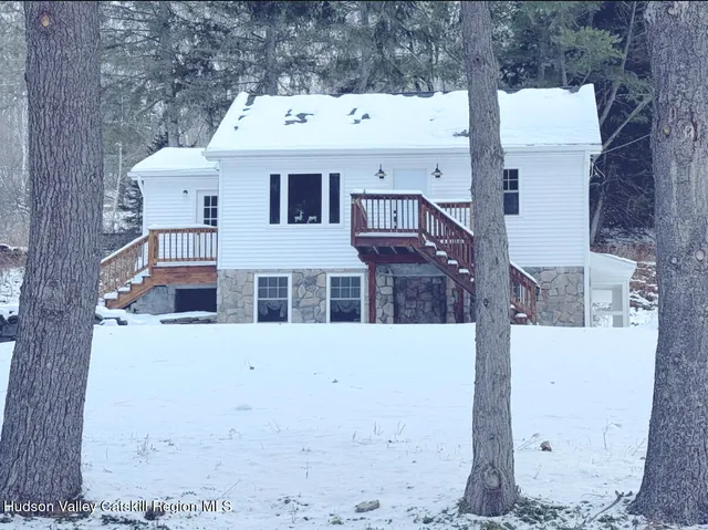a aerial view of a house with a yard