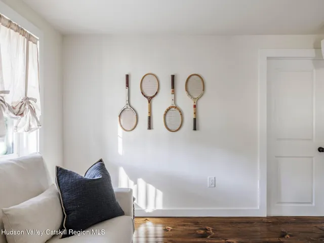 a view of a livingroom with furniture and window