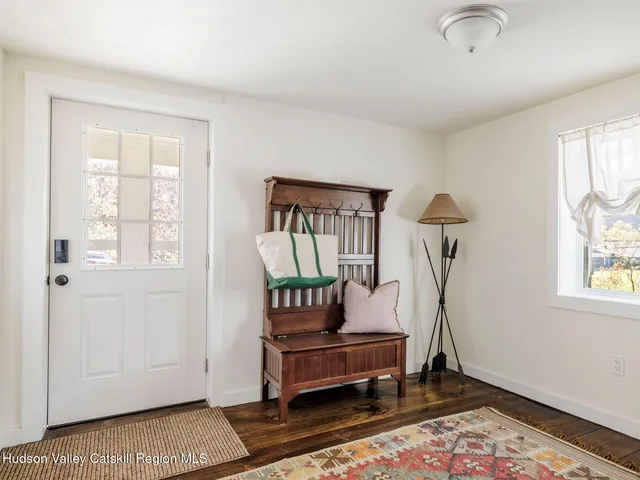 a bedroom with furniture and a window