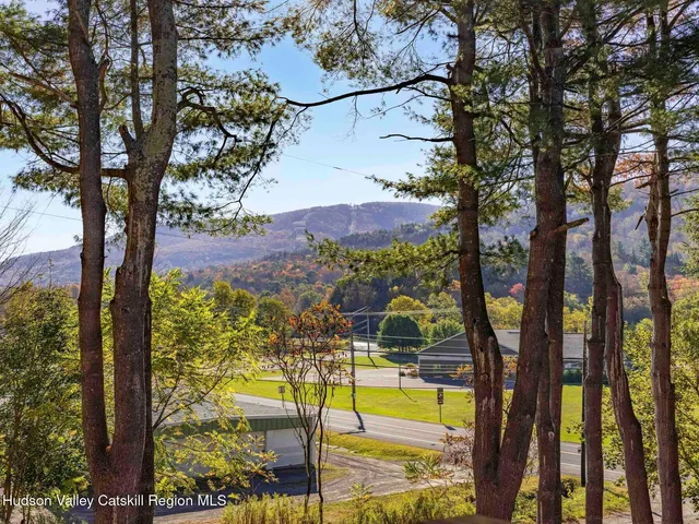 a view of swimming pool with an outdoor seating