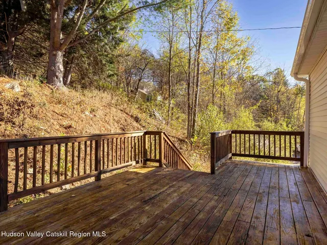 a view of balcony with wooden floor