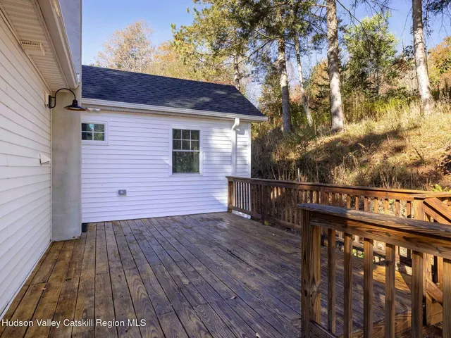 a view of outdoor space with wooden floor and fence