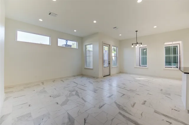 a view of a kitchen with a sink and cabinets