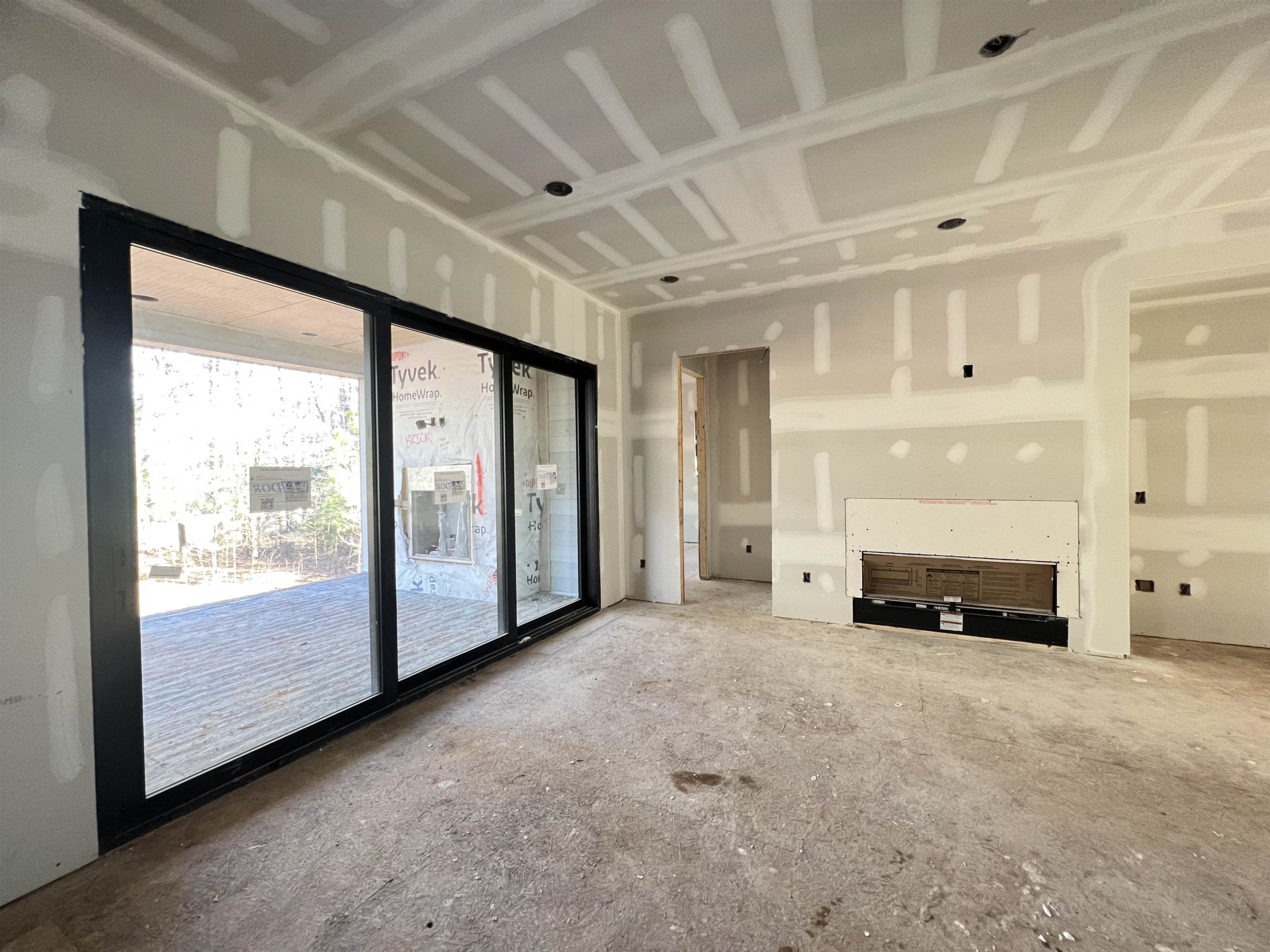 5011 Ten-Ten Road Apex, NC 27539 - Photo 20 of 49 Linear Fireplace with built in cabinets, floating shelf, light fixture above Family Room
