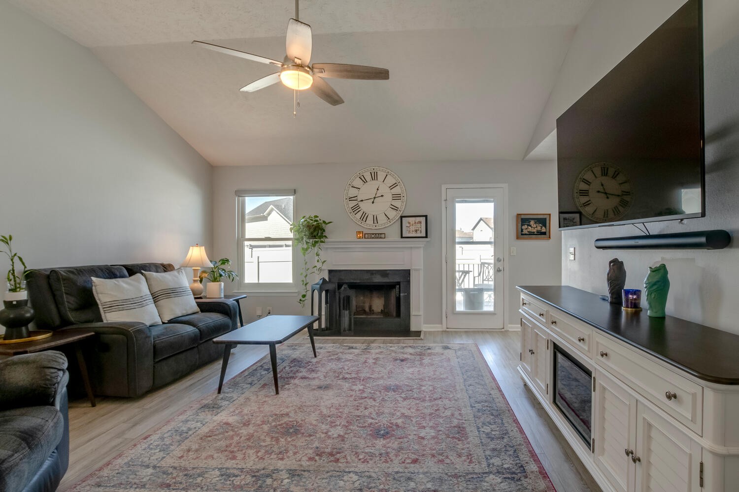 2112 Cason Trail Murfreesboro, TN 37128 - Photo 4 of 25 a living room with furniture a fireplace and a flat screen tv