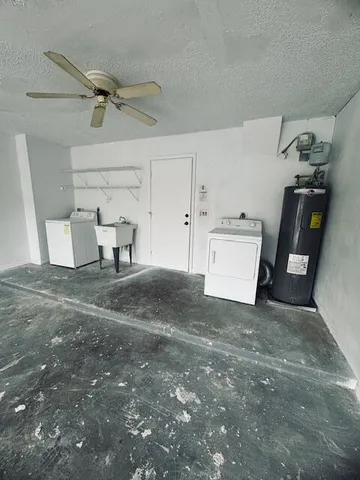 a view of a yard with plants and trees