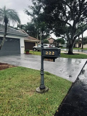 a front view of a house with garden