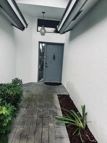 a kitchen with cabinets appliances and a sink