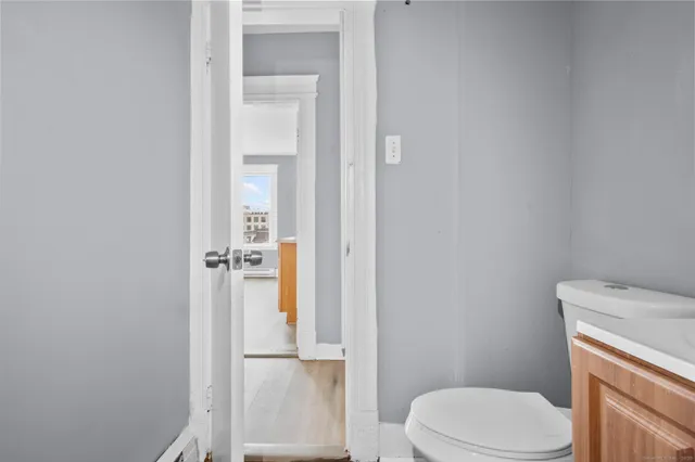 a white toilet sitting next to a bathroom sink