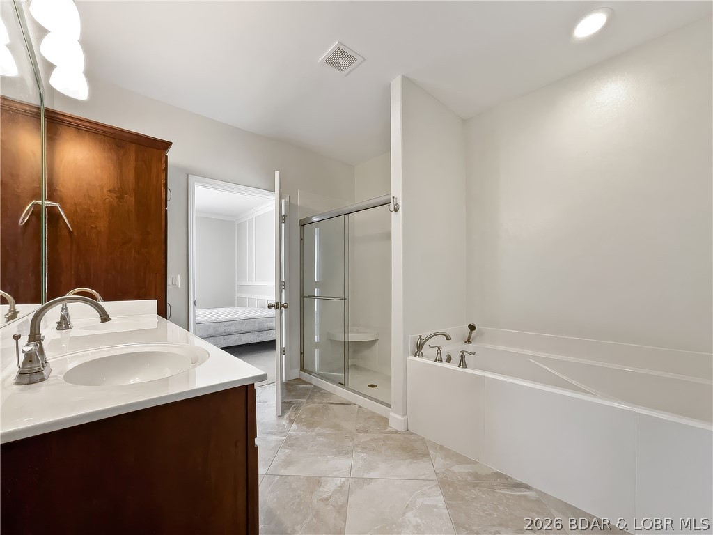 18136 Millstone Cove Road, Unit 141 Gravois Mills, MO 65037 - Photo 27 of 50 Walk-In Shower/ Jetted Tub
