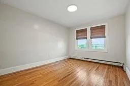 a bedroom with a bed and a shower