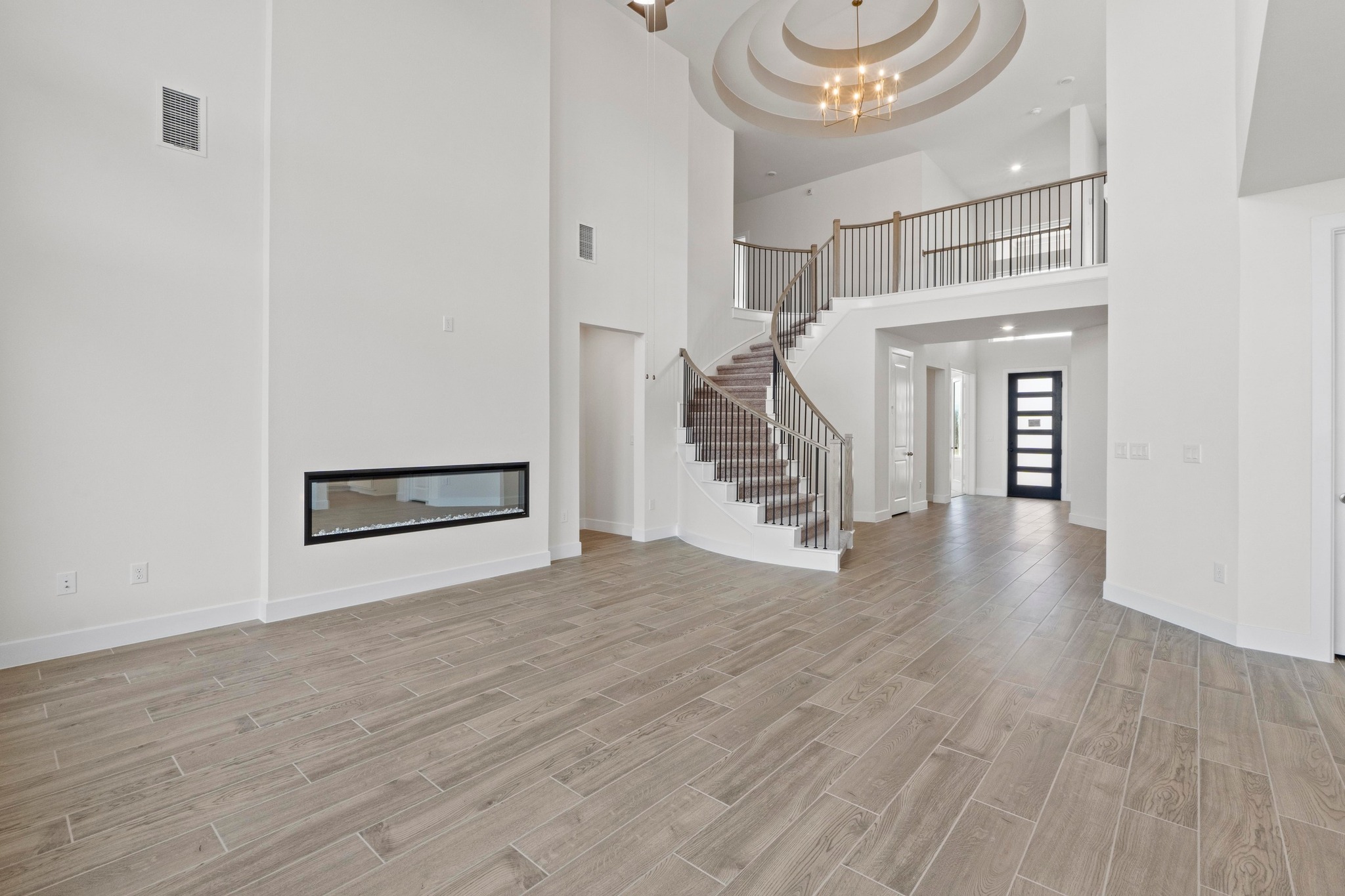 604 Lightstone Drive Georgetown, TX 78633 - Photo 10 of 39 a view of an entryway with wooden floor