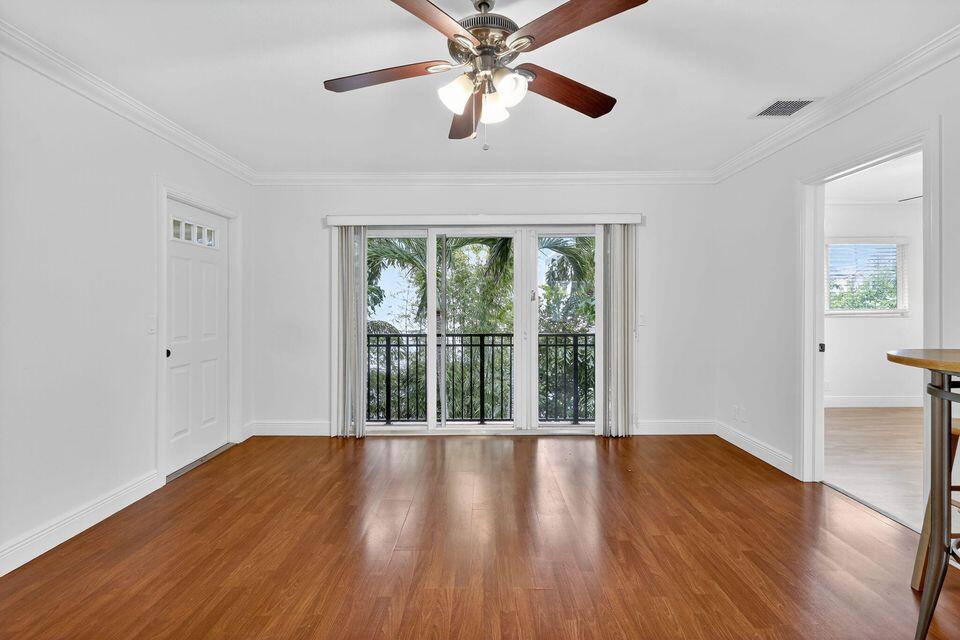 45 Southeast 7th Avenue, Unit 6 Delray Beach, FL 33483 - Photo 1 of 19 a view of an empty room with wooden floor and a window