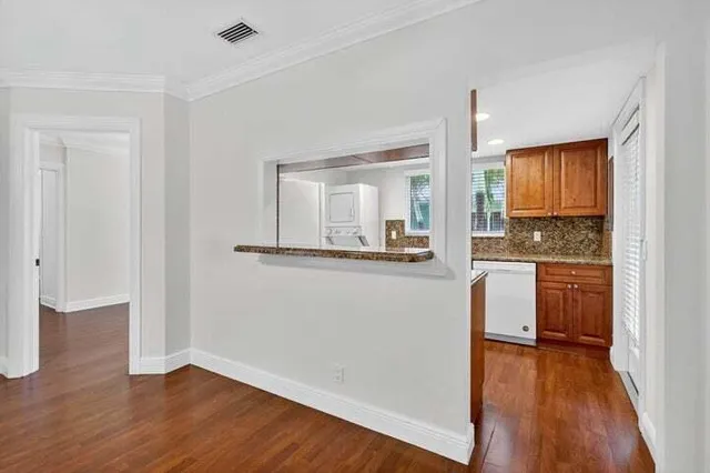 a kitchen with a sink stove and refrigerator
