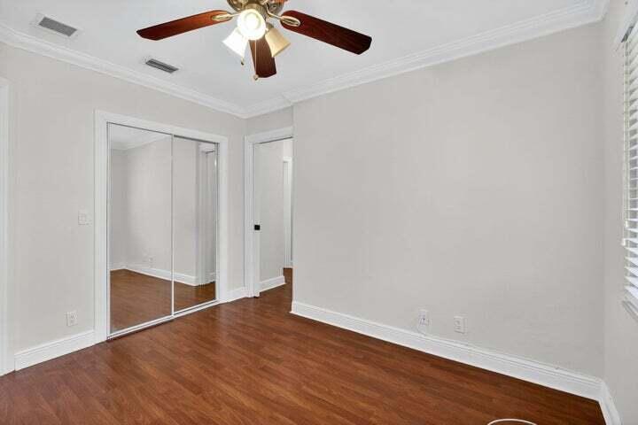45 Southeast 7th Avenue, Unit 6 Delray Beach, FL 33483 - Photo 13 of 19 an empty room with wooden floor and ceiling fan